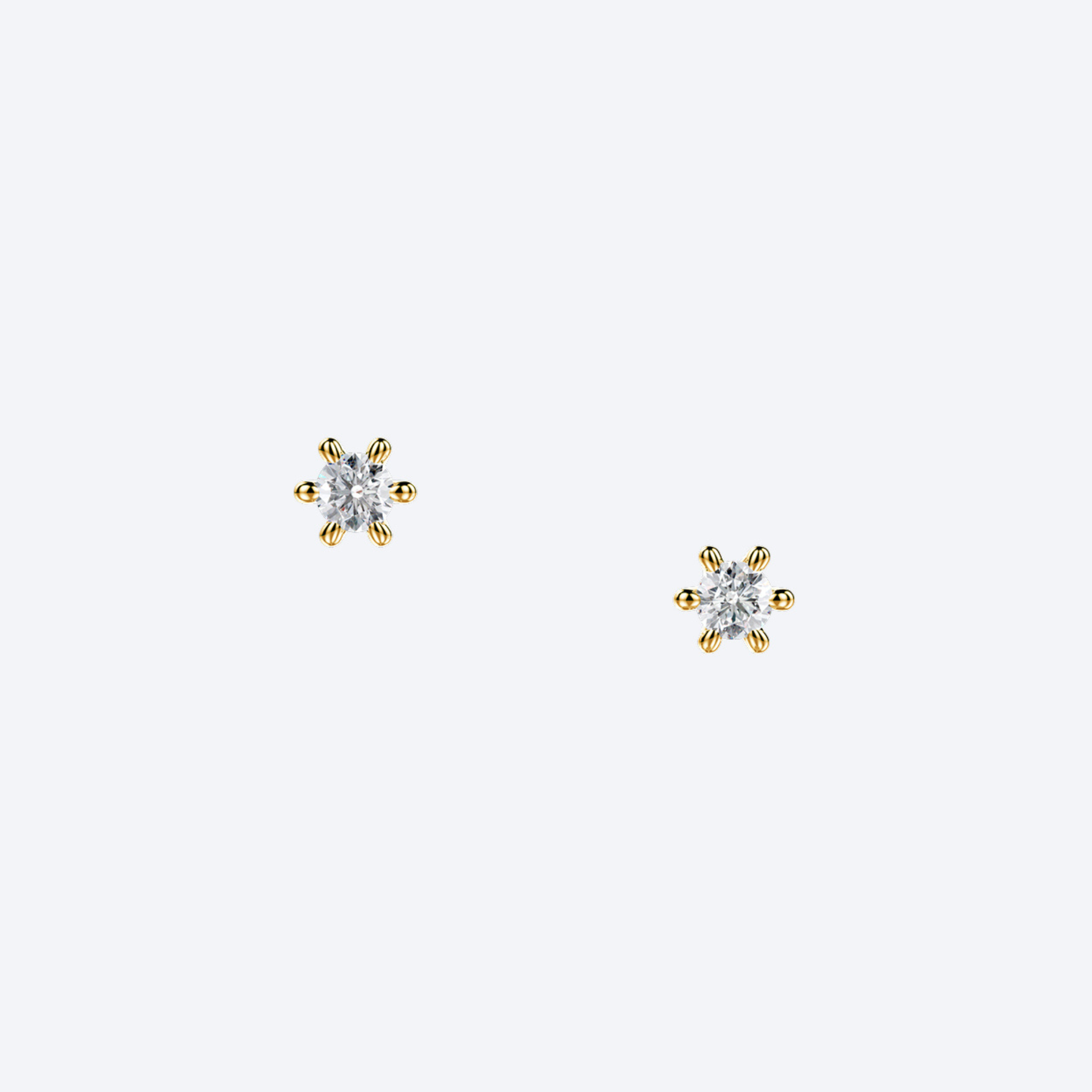 OJL Originals Lumi nappikorvakorut, 2x0.10 ct timanttia, 18k keltakultaa, lähikuva valkoisella taustalla