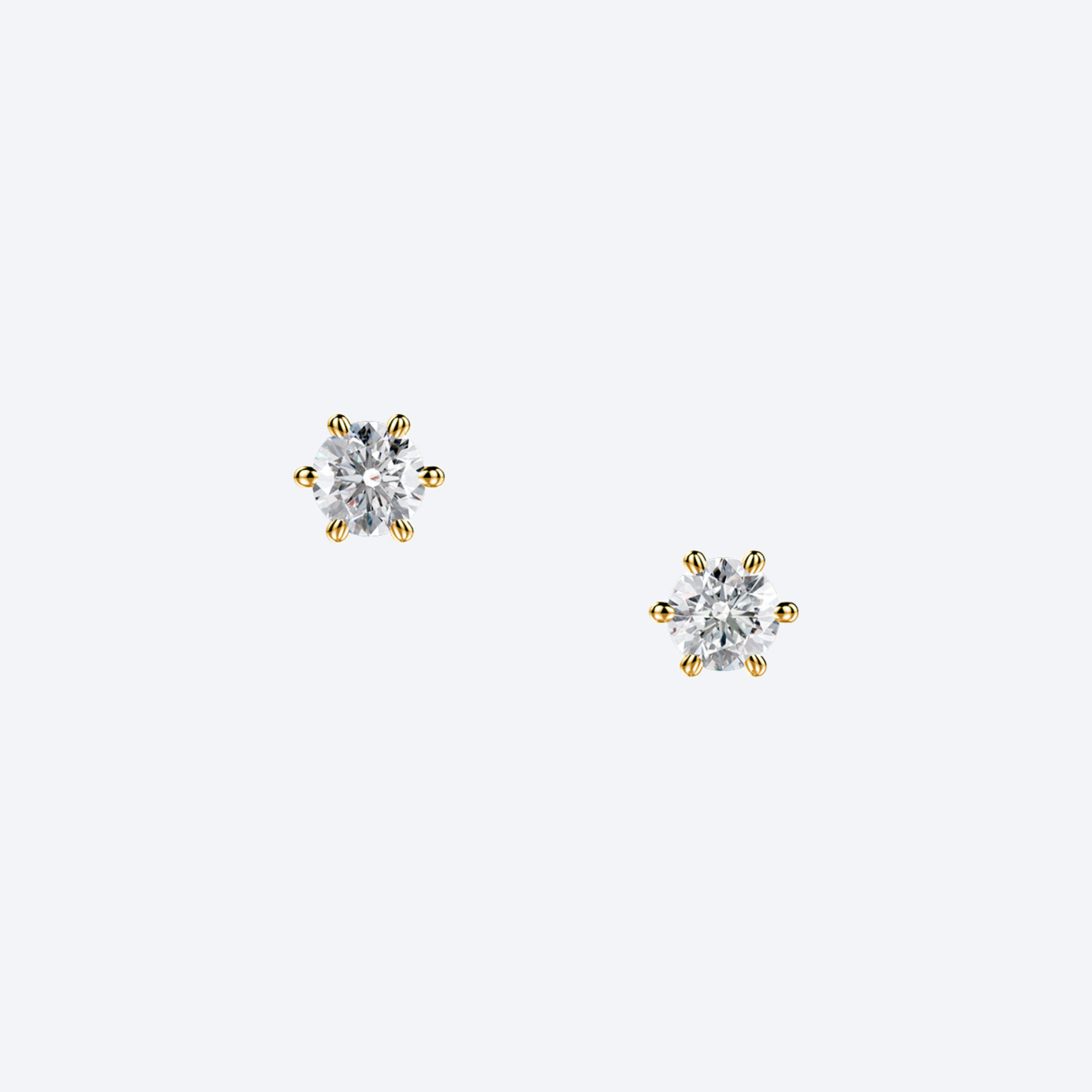 OJL Originals Lumi nappikorvakorut, 2x0.30 ct timanttia, 18k keltakultaa, lähikuva valkoisella taustalla