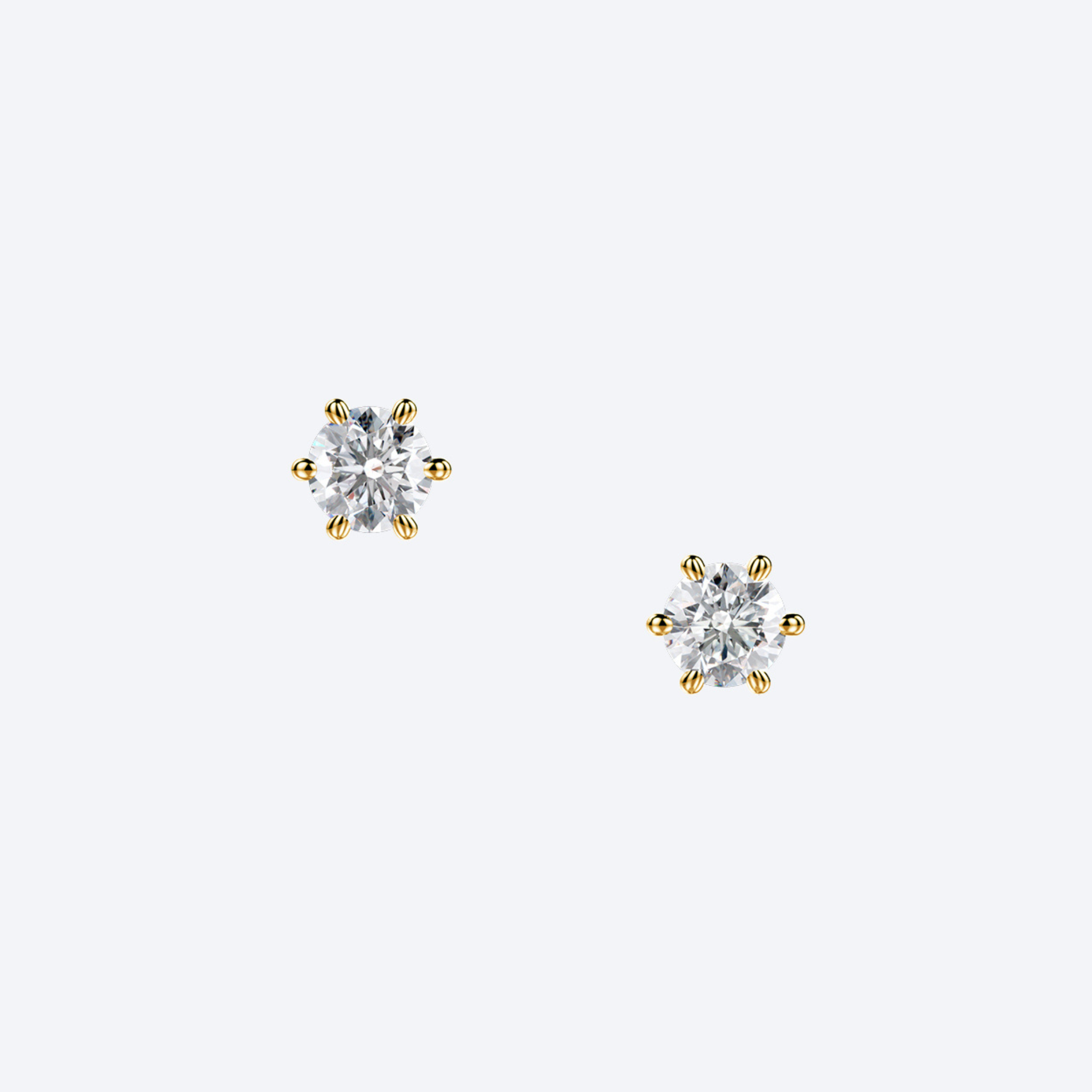 OJL Originals Lumi nappikorvakorut, 2x0.40 ct timanttia, 18k keltakultaa, lähikuva valkoisella taustalla