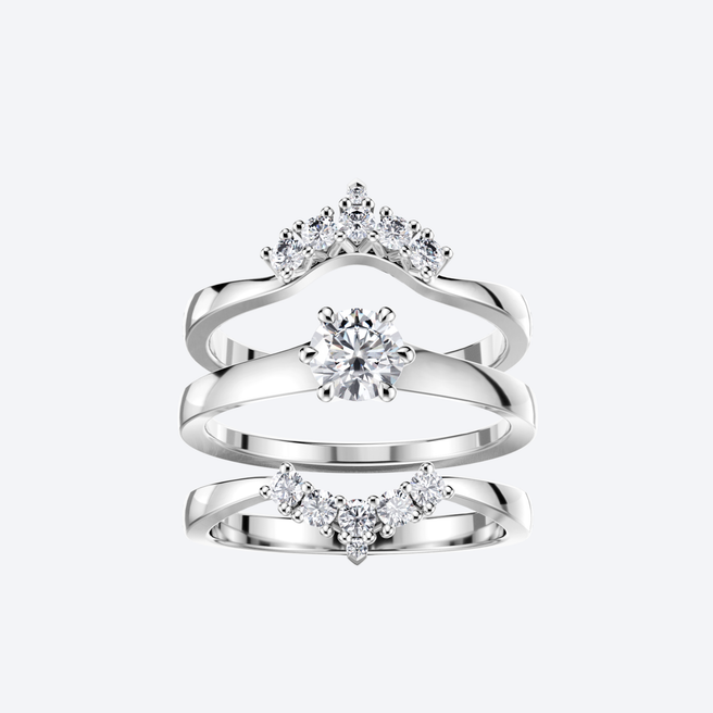 Kaksi Lumi Syleilijä-sormusta valkokultaa, timantteja, yhdistelmä